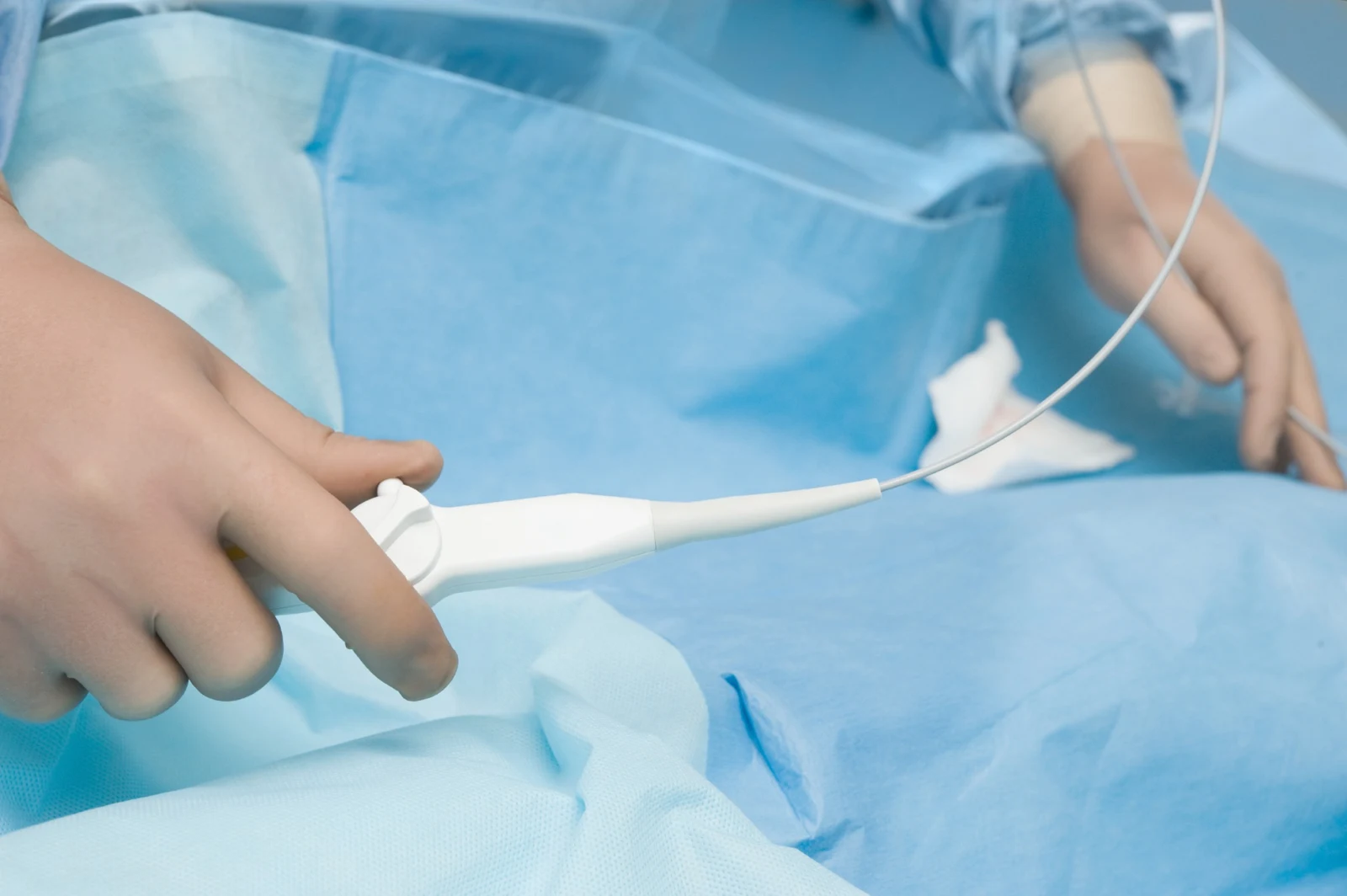 Clinician handling a catheter in a procedural setting